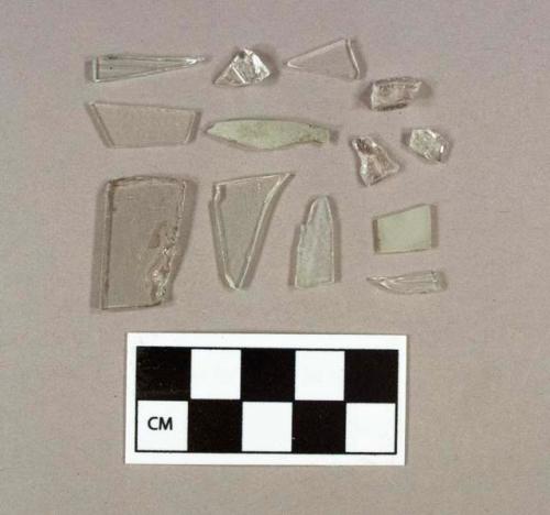 Three fragments of colorless bottle glass; ten fragments of colorless flat glass