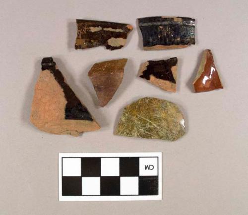 One Nottingham stoneware body sherd; two lead glazed redware body sherds; four lead glazed redware rim sherds, two cross mend