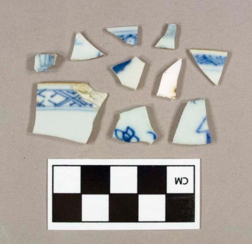 Four blue hand painted porcelain rim sherds, two with brown painted rim; five blue hand painted porcelain body sherds; one undecorated porcelain body sherd