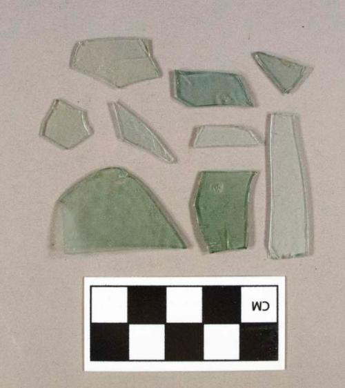 Two aqua bottle glass fragments; 70 aqua flat glass fragments