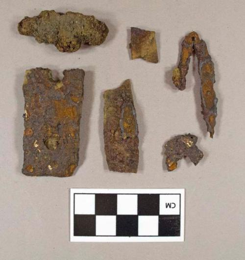 Five fragment of sheet iron; one unidentified iron object; other unidentified iron fragments