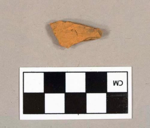 Redware body sherd, finished surface missing both sides