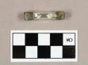Glass and metal fuse with stamped brand name "LITTELFUSE"