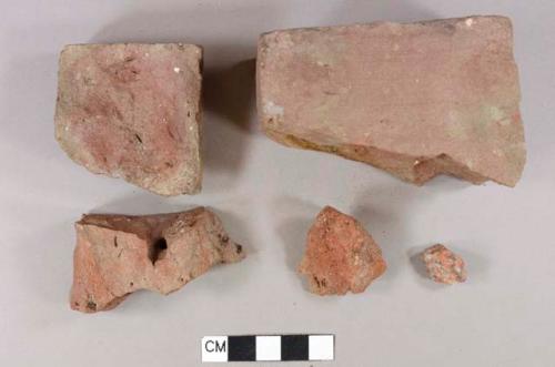 Red brick fragments, 1 red granite(?) fragment