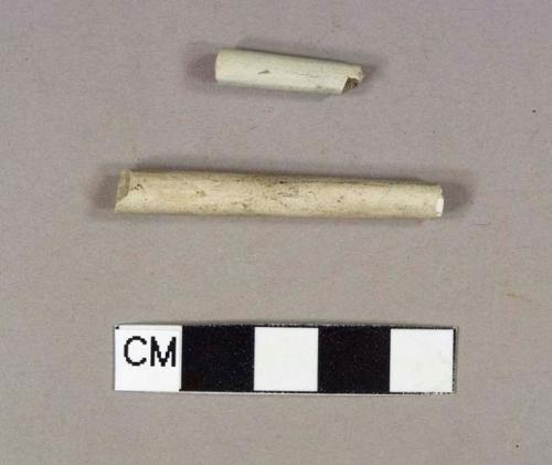 One pipe stem fragment; one pipe mouthpiece fragment