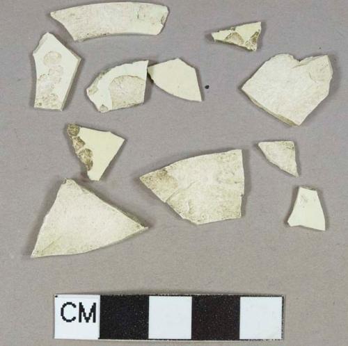 Creamware body fragments, undecorated, highly degraded