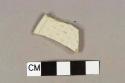 White salt glazed stoneware rim fragment, molded "barley" pattern