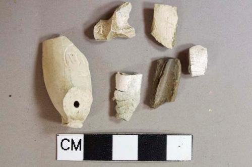 Kaolin pipe bowl fragments, 4 heavily burned, 1 stamped "WM"  on bowl face, 1 stamped "D" and "T" on foot