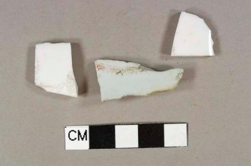 Two porcelain body sherds; one red hand painted overglaze porcelain base sherd