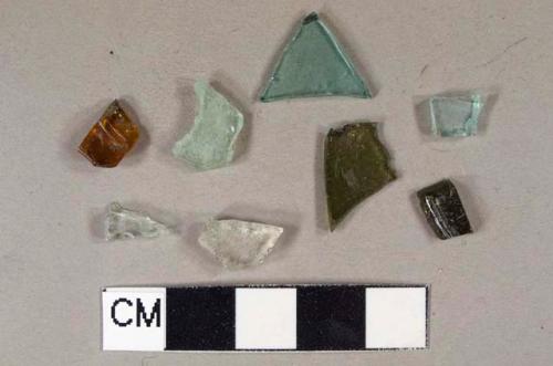 Various colors of vessel glass, body fragments, 3 aqua glass, 2 olive glass, 2 colorless glass, 1 amber glass