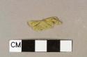 Yellow flat plastic sheet fragment