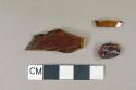 Glass, amber bottle glass fragments, one base fragment