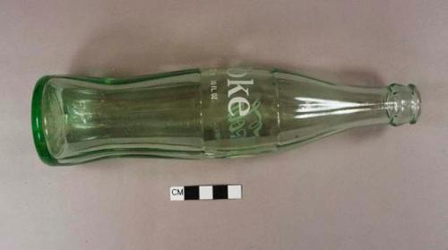 Aqua glass Coca-Cola bottle, painted logo, hobbleskirt shape, embossed on side with "68-13", embossed on bottom with "Denver Colo."