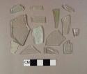 Nine fragments of aqua flat glass; three fragments of colorless flat glass; one fragment of aqua bottle glass; one fragment of colorless bottle glass