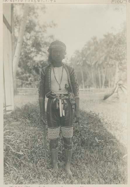 Bagobo man posing with bamboo flute