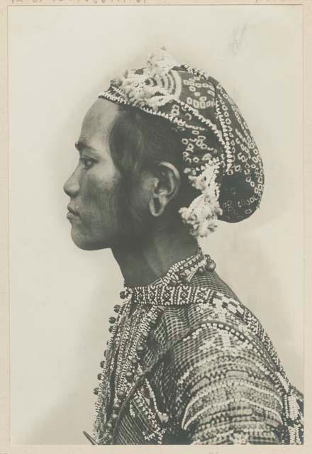 Bagobo man wearing traditional clothing, profile