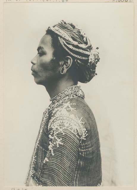 Bagobo man wearing traditional clothing, profile