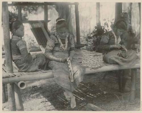 Bagobo women making bead ornaments. Taken at the St. Louis Exposition in 1904