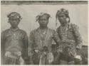 Three Bagobo warriors - their head-dresses show the number of men killed by them