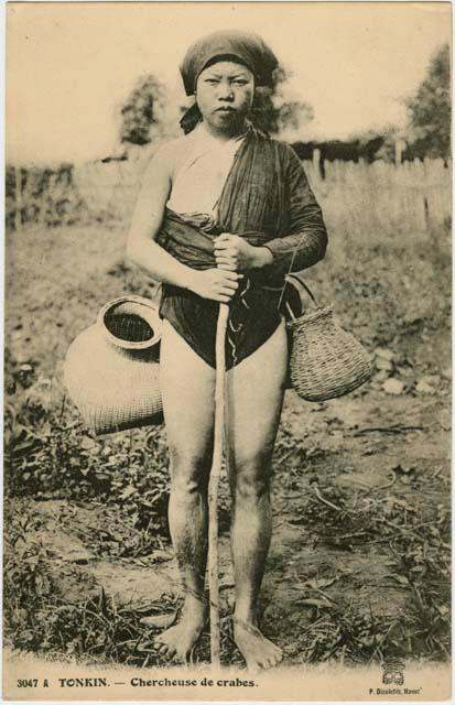 Woman collecting crabs
