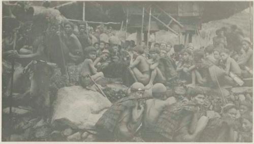 Large group of men and boys sitting