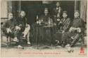 Group of men sitting around a table