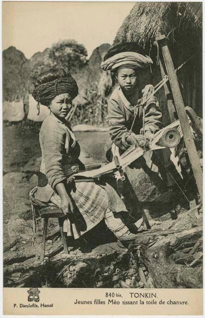 Two women weaving