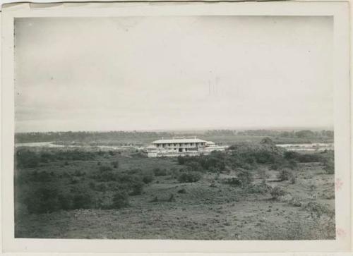 Large multi-story building beside river