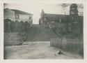 Wooden fence, stone staircase, stone wall, and buildings