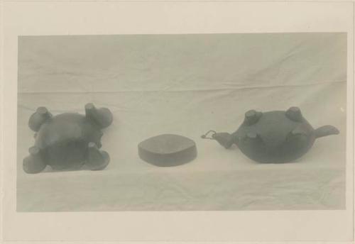 Three small carved wooden bowls, bottom