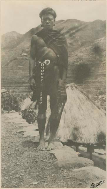 Man standing on top of a stone wall