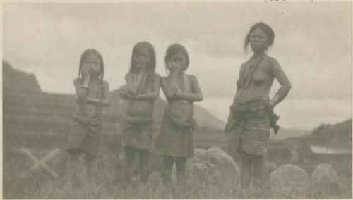 Mother standing with her three daughters