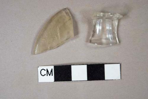 One colorless bottle rim fragment; one colorless glass rim fragment, possible base of stemware