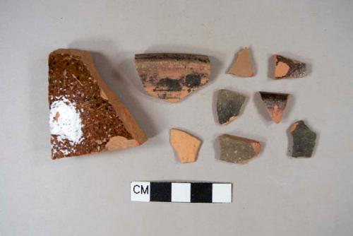 Three unglazed redware body sherds; five lead glazed redware body sherds; one lead glazed redware rim sherd