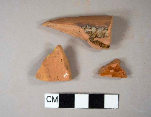 Two lead glazed redware body sherds; one lead glazed redware rim sherd