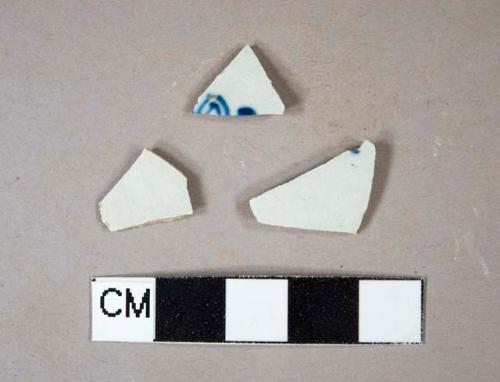 Two blue handpainted pearlware body sherds; one pearlware body sherd; one painted and one plain sherd crossmend