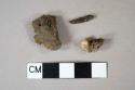 1 slag fragment; 2 ferrous metal fragments, 1 likely nail