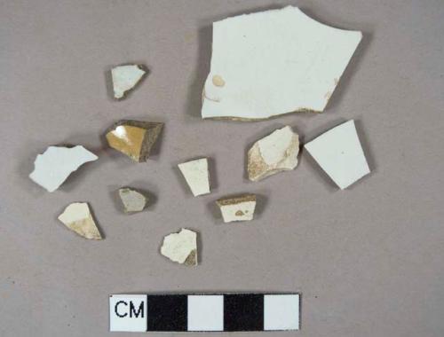 Various ceramic vessel body fragments; 1 white paste white pearlware, 1 gray salt-glazed stoneware, 1 yellow and white lead-glazed earthenware, 4 creamware, 4 white paste white lead-glazed eathenware, all undecorated