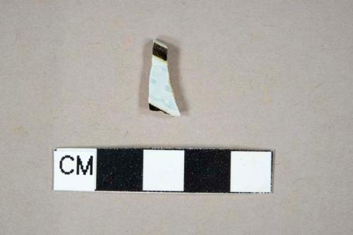 Banded and rouletted blue and brown factory decorated pearlware rim sherd