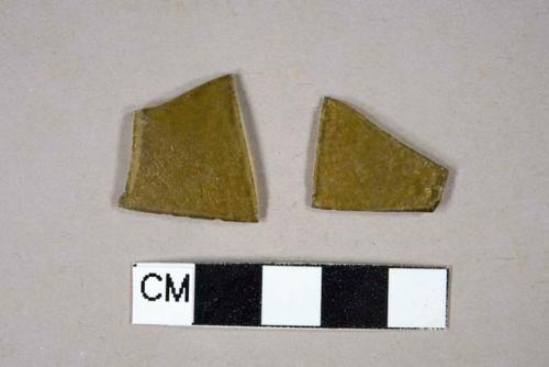 Molded olive green bottle glass fragments with textured surface