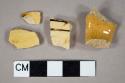 Three Staffordshire slipware body sherds; one Staffordshire slipware handle sherd