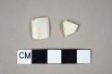 One undecorated pearlware body sherd; one undecorated pearlware handle sherd