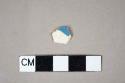 Factory decorated pearlware body sherd with blue decoration