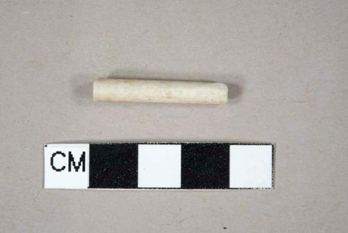 Unsmoked, undecorated pipe mouthpiece fragment, 5/64" bore diameter; cross mends with one stem fragment