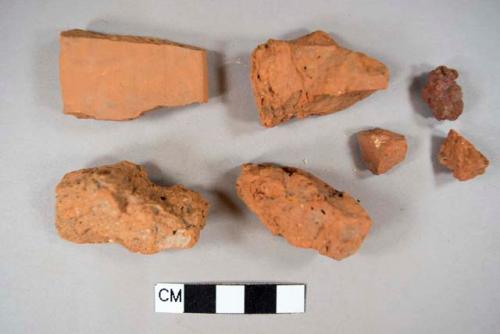 6 red brick fragment, 1 terracotta fragment (possible roof tile)