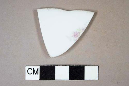 Handpainted overglaze porcelain sherd with floral design and scalloped, gilded rim