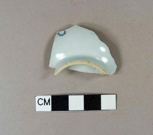 Blue hand painted porcelain base sherd with tall footring, likely tea cup