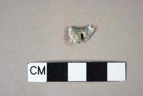 White metal fragment with possible rivet attached