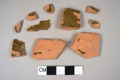 Undecorated, brown lead glazed redware body sherds; two crossmend; one crossmends with one unglazed redware body sherd