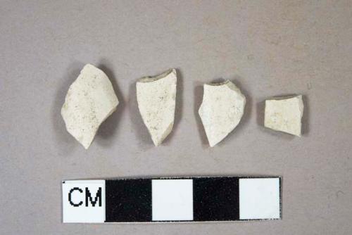 Smoked pipe bowl fragments, three undecorated, one with possible "TD" cartouche; three fragments crossmend